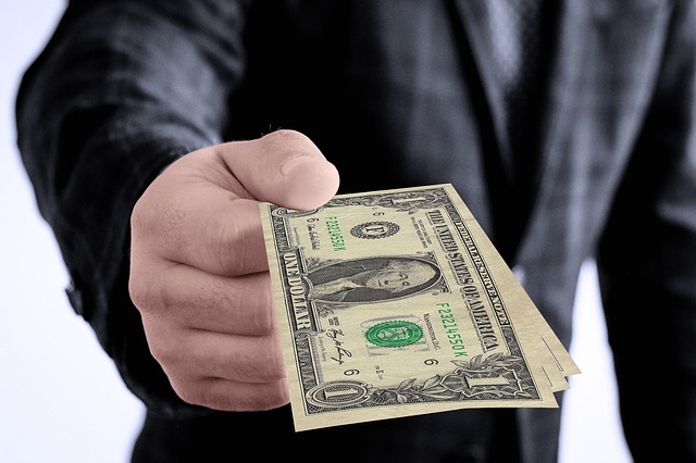 Handing money over